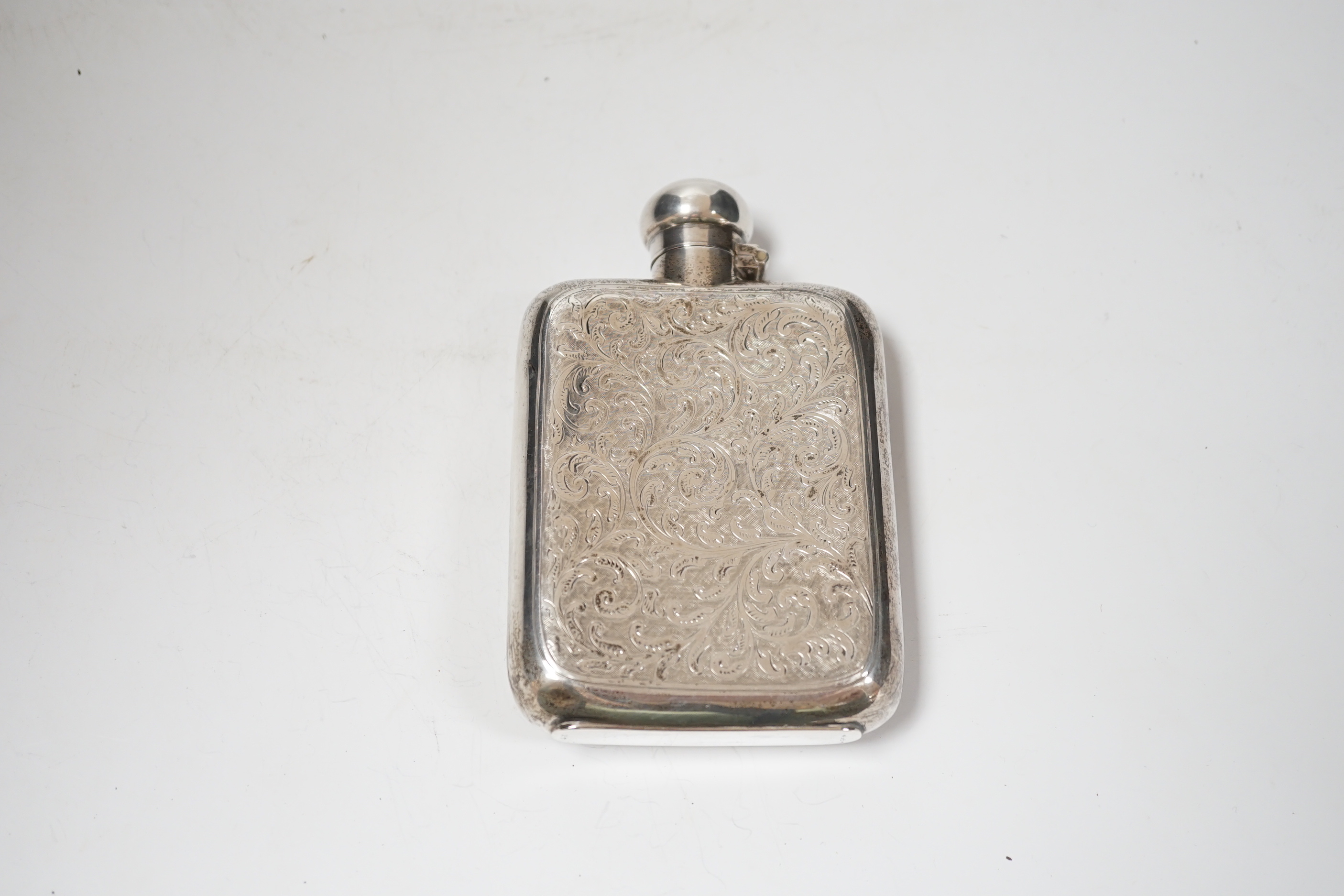 An Edwardian engraved silver hip flask, G & JW Hawksley, Sheffield, 1901, 13.7cm.